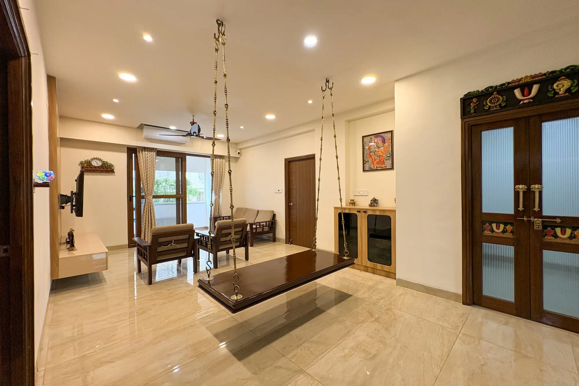 Living room with a wooden swing and TV unit, Ramaniyam Abbotsbury, Alwarpet, Chennai