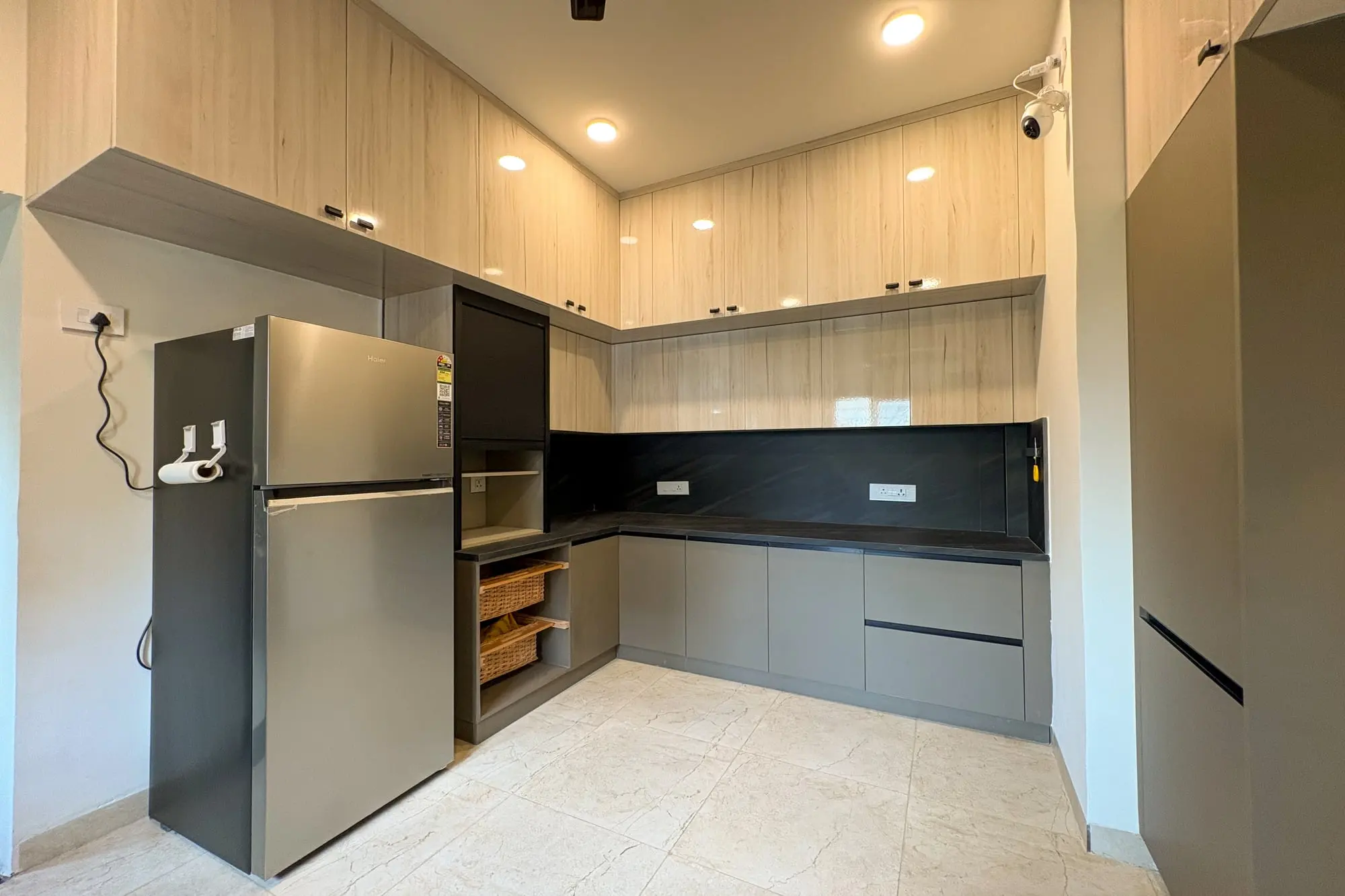 L-shaped modular kitchen with grey cabinets, Ramaniyam Abbotsbury, Alwarpet, Chennai