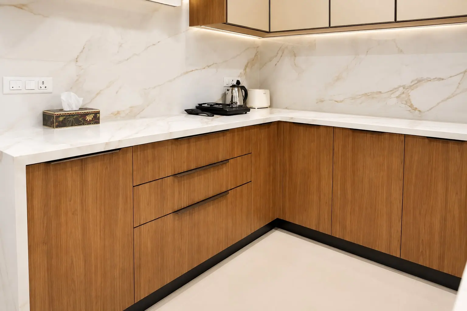 L-shaped kitchen with wood-finish drawers, Hiranandani, OMR, Chennai