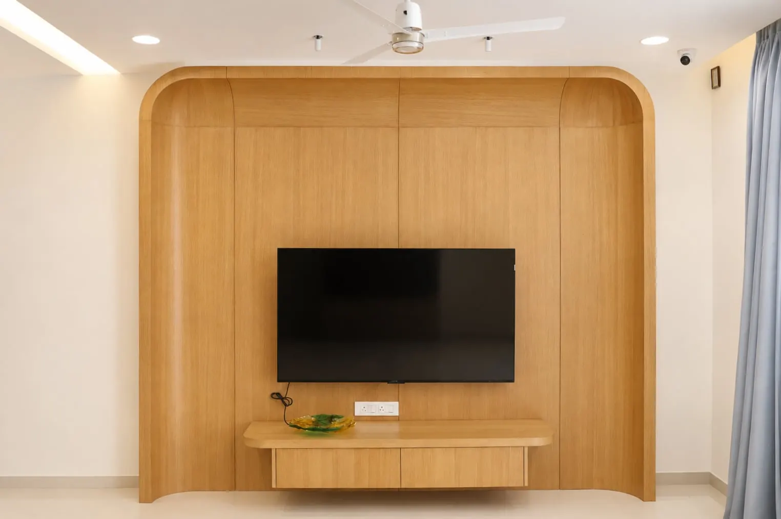 Curved walnut TV wall, Hiranandani, OMR, Chennai